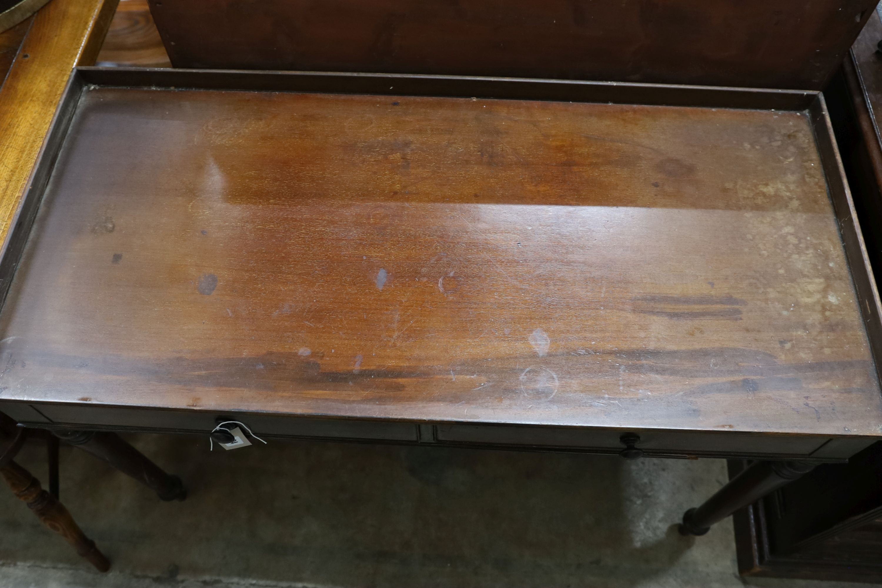 An early Victorian mahogany washstand, with a three quarter galleried top, width 115cm, depth 53cm, height 79cm